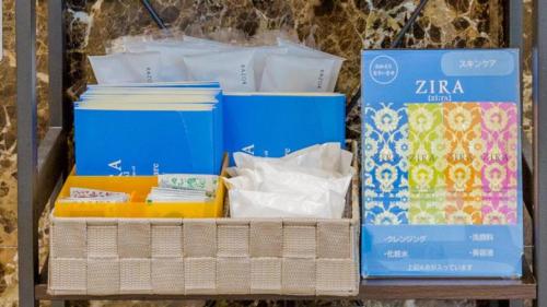 a shelf filled with different boxes and papers at Toyoko Inn Shonan Hiratsuka eki Kita guchi No 2 in Hiratsuka