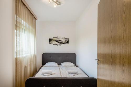 מיטה או מיטות בחדר ב-MF Club 218 D1-1 Wellness Apartment