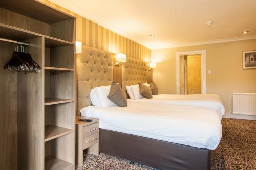 Ένα ή περισσότερα κρεβάτια σε δωμάτιο στο Albion Hotel