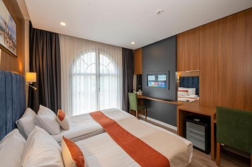 Ένα ή περισσότερα κρεβάτια σε δωμάτιο στο Harmony Hotel Istanbul & SPA