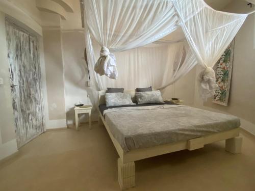 Postel nebo postele na pokoji v ubytování Watamu Shell House