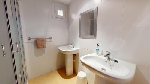 a white bathroom with a sink and a mirror at Espliego 3I5778-A Murcia Holiday Rentals Property in Torre-Pacheco