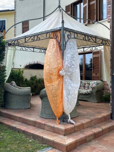 two surfboards on display under a gazebo at Villa con piscina tra Versilia e Cinque Terre in Luni