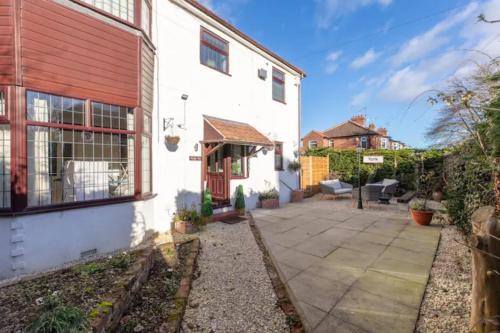 an exterior view of a house with a patio at Camaraderie Guest House in York