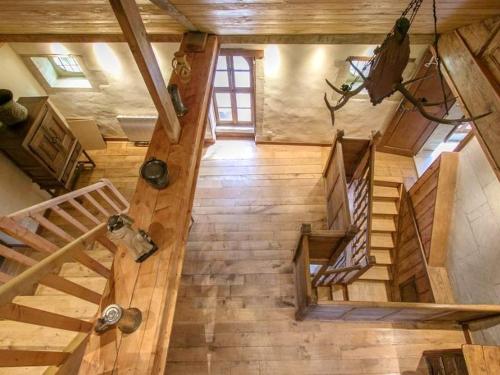 an overhead view of a wooden staircase in a house at Maison spacieuse à Saint-Martin-des-Entrées avec jardin in Saint-Martin-des-Entrées