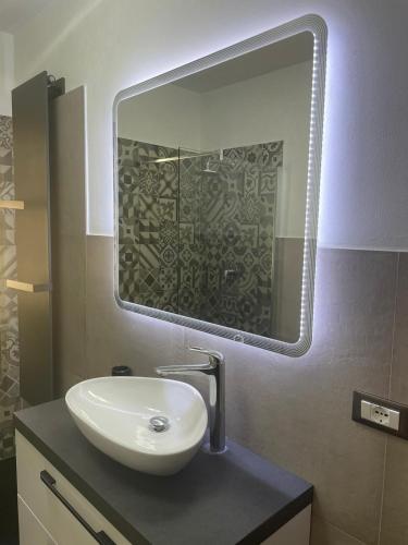 a bathroom with a sink and a mirror at Aethalia Bed and Breakfast in Portoferraio