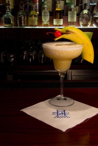 a banana peel on top of a drink on a napkin at Hotel San Rocco in Orta San Giulio