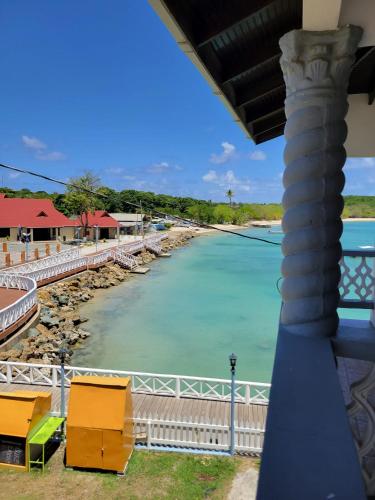 a view of a river from a balcony at Memories Cottage and Apartments in Buccoo