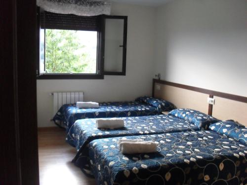 Кровать или кровати в номере Pensión la Posada