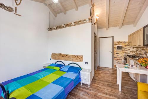 a bedroom with a bed and a table in a room at Pelagos in Pompeiana
