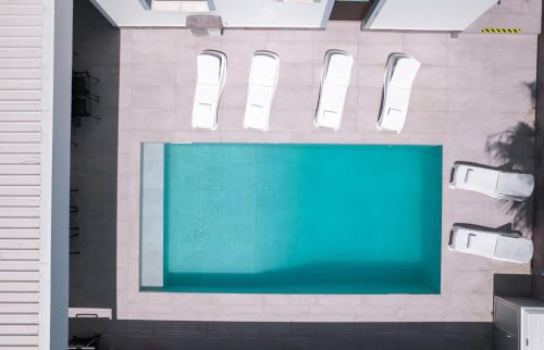 a swimming pool in the middle of a building at Luxury Villa Agathoula in Protaras