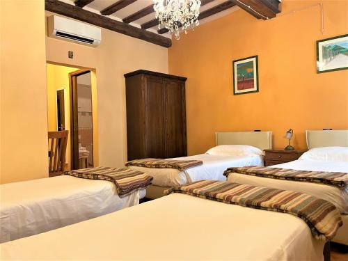Katil atau katil-katil dalam bilik di Hotel Residence La Contessina