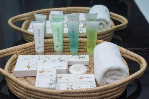 a basket with towels and diffusers in it at Kambiri Beach by Serendib in Senga