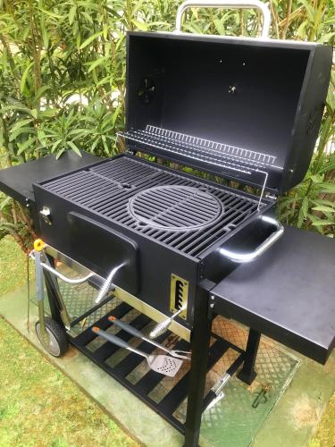 a grill sitting on top of a cart at Luxury VILLA LE ROSE in Poreč