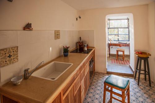 a kitchen with a sink and a counter at The Nest - A Romantic Vacation Home in Ein Kerem - Jerusalem in Jerusalem