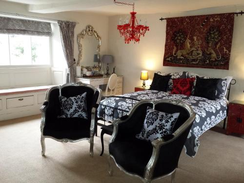 a living room filled with furniture and decorations at Longbridge House in Shepton Mallet
