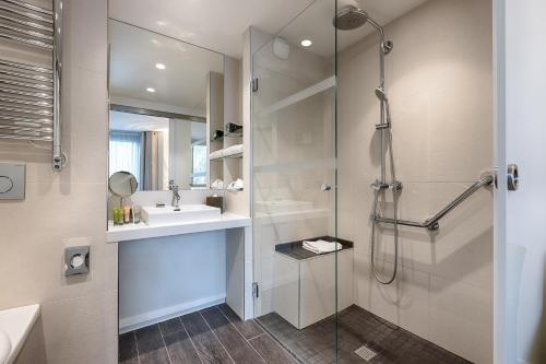 a bathroom with a shower and a sink at Garden-Elysée in Paris