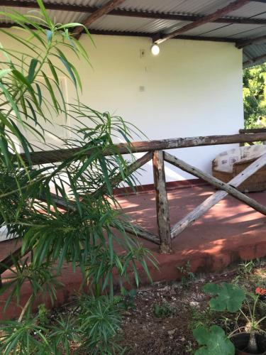 a wooden fence in front of a building at Tayana place in Kizimkazi