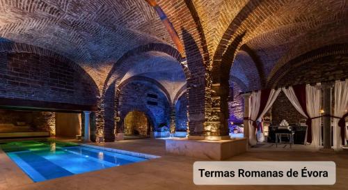 a large room with an indoor pool in a building at Casa Gil Vicente in Évora