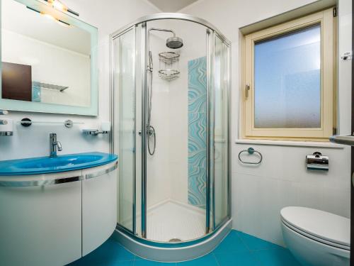 Koupelna v ubytování APARTMANI KRAJ