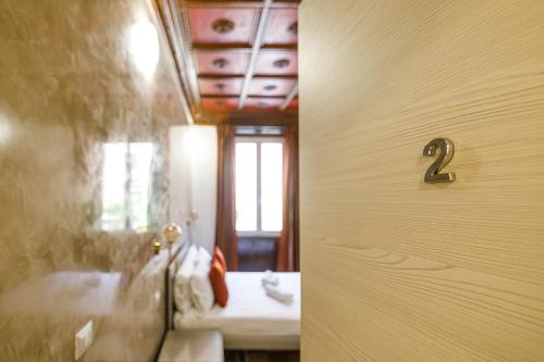 a door to a bathroom with two sinks at Erreggi Luxury Rooms in Rome