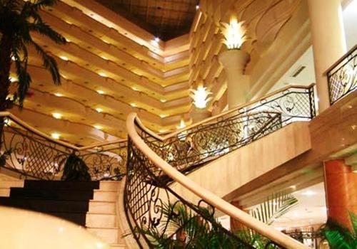 a spiral staircase in a building with lights at Berjaya Waterfront Hotel, Johor Bahru in Johor Bahru