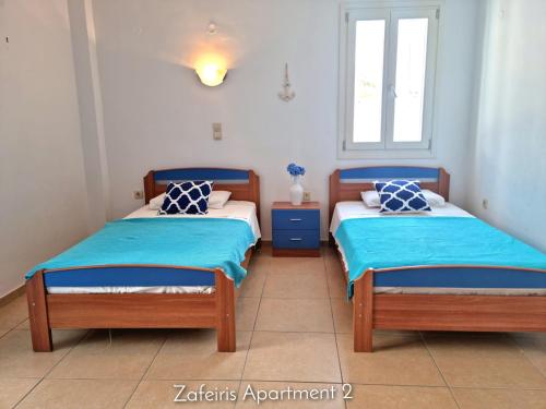 Postel nebo postele na pokoji v ubytování Zafeiris Apartments