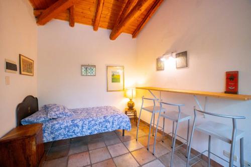 A bed or beds in a room at Etna Botanic Garden