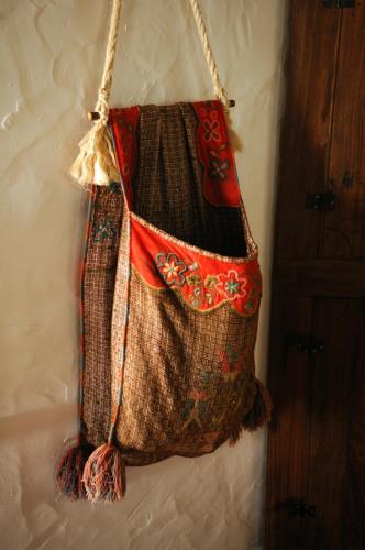 a bag hanging on a wall at Casa Da Seiceira in São Teotónio