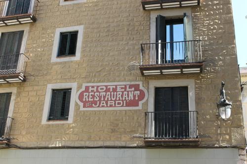 a building with a sign on the side of it at El Jardi in Barcelona