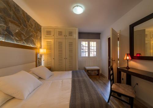 Ένα ή περισσότερα κρεβάτια σε δωμάτιο στο CASA RURAL EL ESQUILON TENERIFE