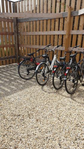 a group of bikes parked next to a fence at B&B 't Meesterhof in Deinze