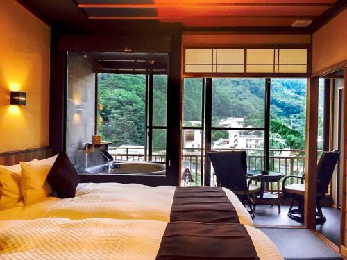 Postel nebo postele na pokoji v ubytování LiVEMAX RESORT Kawaji