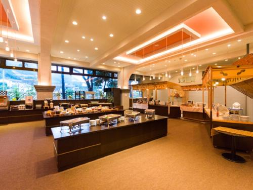 a restaurant with a buffet line in a building at LiVEMAX RESORT Kawaji in Nikko