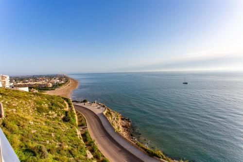 a view of the ocean and a road at Cullera Panoramic Sea Views Apartment in Cullera