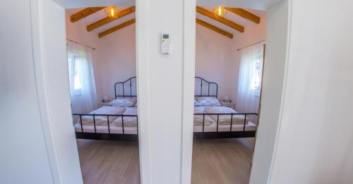 Postel nebo postele na pokoji v ubytování Ranc Vitina