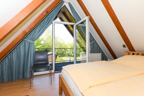 Postel nebo postele na pokoji v ubytování Hus achtern Diek