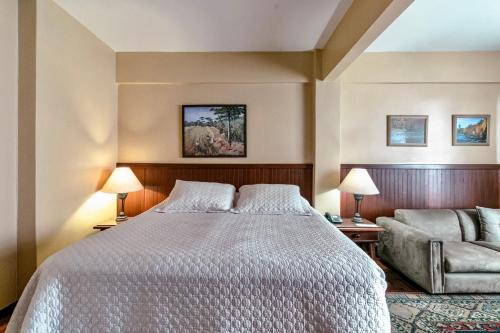 Ένα ή περισσότερα κρεβάτια σε δωμάτιο στο Hotel San Rafael