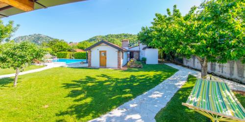 a backyard with a pool and a house at Ranc Vitina in Ljubuški