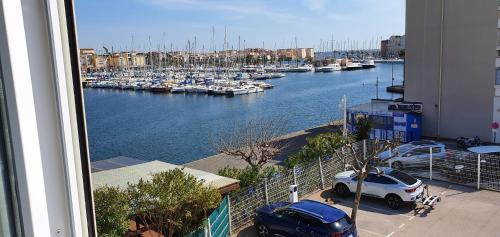 a view of a marina with boats in the water at Hôtel Port Beach in Gruissan