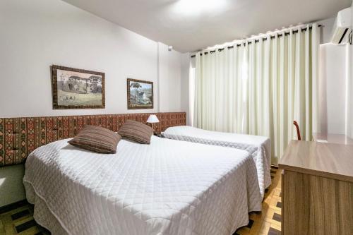 Ένα ή περισσότερα κρεβάτια σε δωμάτιο στο Hotel San Rafael