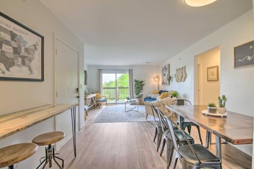 a living room with a table and chairs at Cozy Branson Retreat with Balcony, 2 Mi to 76 Strip in Branson