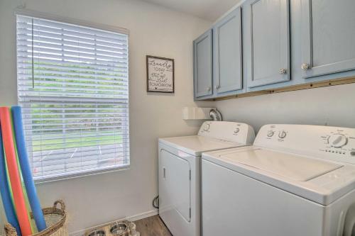 a white washer and dryer in a laundry room at Cozy Branson Retreat with Balcony, 2 Mi to 76 Strip in Branson