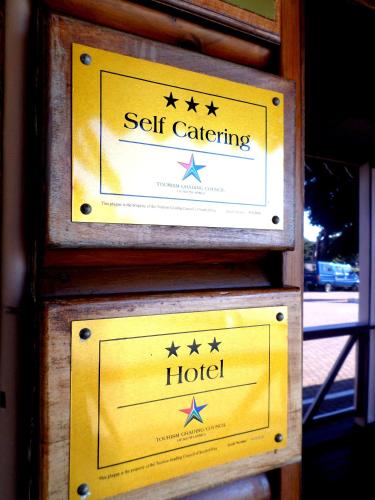 Un certificado, premio, letrero u otro documento en Oceans Hotel & Self Catering