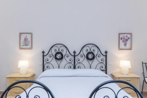 Posteľ alebo postele v izbe v ubytovaní Casa Fiorenza