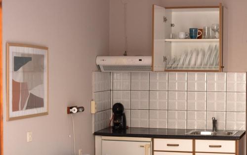 A cozinha ou cozinha compacta de Pomelo Rooms