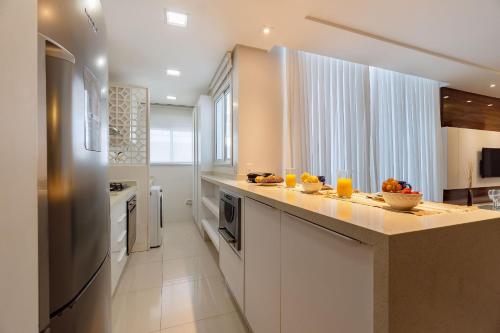 Dapur atau dapur kecil di Varandas do Atlântico - Apartamento em Condomínio Pé na Areia