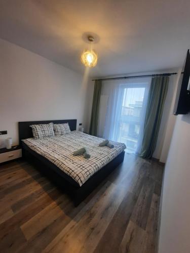 Ένα ή περισσότερα κρεβάτια σε δωμάτιο στο Apartament Coco