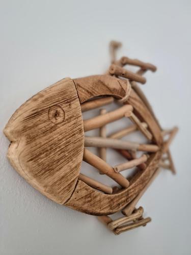 a wooden heart made out of wooden sticks at Casa Mafalda in Chioggia