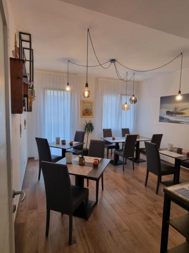 a dining room with tables and chairs at Casa Mafalda in Chioggia